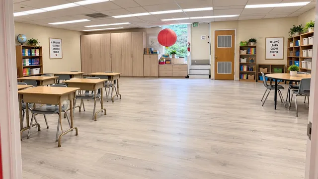 Light wood-look flooring across a bright classroom interior.